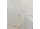 White bathroom door and vanity at 9661 Summers Cay Cir, Thonotosassa, FL 33592