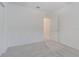 Carpeted bedroom with a doorway to another room at 9661 Summers Cay Cir, Thonotosassa, FL 33592