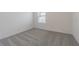 Carpeted bedroom with a window with blinds and baseboards at 9661 Summers Cay Cir, Thonotosassa, FL 33592