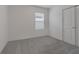 Carpeted bedroom with a window with blinds and a closet to the side at 9661 Summers Cay Cir, Thonotosassa, FL 33592