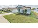 Charming single-Gathering home featuring a manicured lawn and attached two-car garage at 9661 Summers Cay Cir, Thonotosassa, FL 33592