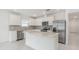 Bright kitchen featuring white cabinets, stainless steel appliances, and center island at 9661 Summers Cay Cir, Thonotosassa, FL 33592