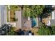 An aerial view of the home with a screened pool, landscaped yard, and proximity to mature trees at 414 Mahogany Dr, Seffner, FL 33584