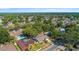 An aerial view of the neighborhood shows the home's location amongst mature trees at 414 Mahogany Dr, Seffner, FL 33584