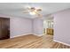 Serene bedroom with wood floors and a light purple color scheme, offering a tranquil retreat at 414 Mahogany Dr, Seffner, FL 33584