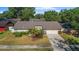 Charming single-story home with a well-manicured lawn and attached two-car garage at 414 Mahogany Dr, Seffner, FL 33584