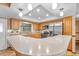 Functional kitchen featuring modern appliances, wood cabinets, and a breakfast bar area for casual dining at 414 Mahogany Dr, Seffner, FL 33584