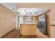 Bright kitchen with breakfast bar area, stainless steel appliances, and ample cabinet space at 414 Mahogany Dr, Seffner, FL 33584