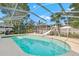 Screened pool with slide and a relaxing view of the backyard and mature landscaping at 414 Mahogany Dr, Seffner, FL 33584