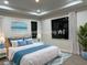 Bedroom with new bed, beach-themed decor, and plenty of natural light at 20296 Rutherford Ave, Port Charlotte, FL 33952