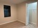 Bright bedroom with a window and an open closet showcases the neutral color palette at 20296 Rutherford Ave, Port Charlotte, FL 33952
