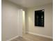 Bedroom featuring an open closet with wire shelving, wood-look floors and natural light at 20296 Rutherford Ave, Port Charlotte, FL 33952