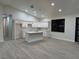 Modern kitchen featuring white cabinetry, a large island, and pendant lighting at 20296 Rutherford Ave, Port Charlotte, FL 33952