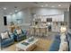 Modern living area features vaulted ceilings, kitchen island with stools and hardwood floors at 20296 Rutherford Ave, Port Charlotte, FL 33952