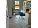 Bright office featuring a built in bookcase, a large desk and light colored wood-look floors at 20296 Rutherford Ave, Port Charlotte, FL 33952