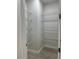 Walk-in pantry with wire shelving and tiled floor at 20296 Rutherford Ave, Port Charlotte, FL 33952