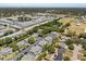 Expansive aerial view of a condo community featuring lush landscaping and beautiful pond views at 5744 Calais N Blvd # 4, St Petersburg, FL 33714