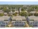 Aerial view of multi-Gathering residential, surrounded by trees and neighborhood, offering pleasant community at 5744 Calais N Blvd # 4, St Petersburg, FL 33714