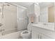 Bright bathroom features a shower-tub combo and functional vanity for everyday use at 5744 Calais N Blvd # 4, St Petersburg, FL 33714