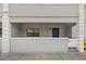 Charming covered entry with painted porch with front-facing window and blue entry door at 5744 Calais N Blvd # 4, St Petersburg, FL 33714