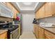 Well-lit kitchen with ample cabinetry, stainless steel appliances, and plenty of counter space at 5744 Calais N Blvd # 4, St Petersburg, FL 33714