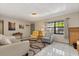 Comfortable living room with tile floors, neutral paint, and a large window for natural light at 5744 Calais N Blvd # 4, St Petersburg, FL 33714