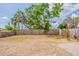 Expansive backyard featuring a wooden fence, mature trees, and ample space for outdoor activities at 4010 Emerson S Ave, St Petersburg, FL 33711