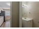 Bathroom with a view to the kitchen with white cabinets at 4010 Emerson S Ave, St Petersburg, FL 33711
