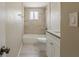 Bathroom with tile shower, updated vanity, granite countertops and a toilet at 4010 Emerson S Ave, St Petersburg, FL 33711