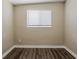Bedroom with plank flooring and window with white blinds at 4010 Emerson S Ave, St Petersburg, FL 33711