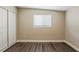 Bedroom features new flooring, a window, and a closet at 4010 Emerson S Ave, St Petersburg, FL 33711