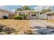 Charming single-story home with a well-lit exterior and a neatly maintained front yard at 4010 Emerson S Ave, St Petersburg, FL 33711