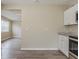 Open concept kitchen with granite counters, a view into the living space, and modern finishes at 4010 Emerson S Ave, St Petersburg, FL 33711