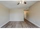 Spacious living room with updated flooring, ceiling fan, and neutral paint, creating a welcoming atmosphere at 4010 Emerson S Ave, St Petersburg, FL 33711