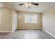 Cozy living room featuring neutral walls, updated flooring, and bright, natural light at 4010 Emerson S Ave, St Petersburg, FL 33711