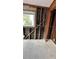Bedroom renovation with exposed studs, electrical wiring, and a window view at 3141 Irving St, Sarasota, FL 34237
