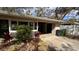 View of the front of the home highlighting the covered entry and front yard landscaping at 3141 Irving St, Sarasota, FL 34237