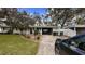 Charming single story home with lush front yard, inviting entrance, and car port at 3141 Irving St, Sarasota, FL 34237