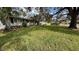 Beautiful home with a sprawling, well-maintained lawn and mature shade trees at 3141 Irving St, Sarasota, FL 34237