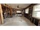 Open concept renovation with exposed wood framing and expansive natural light from large windows at 3141 Irving St, Sarasota, FL 34237