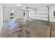 Large two car garage with windows offers ample space for parking and storage at 9420 Ripley Rd, Thonotosassa, FL 33592