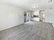Spacious living room with neutral carpet, recessed lighting, and seamless flow into dining area at 9420 Ripley Rd, Thonotosassa, FL 33592