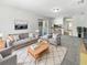 Cozy living room features neutral colors, plush carpet, and sliding doors for bright natural light at 9420 Ripley Rd, Thonotosassa, FL 33592