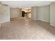 Open-concept living space with tile floors, ceiling fan, and adjacent kitchen area at 9481 Highland Oak Dr # 609, Tampa, FL 33647