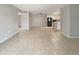 An airy living room featuring tiled floors with seamless flow for a cohesive living space at 9481 Highland Oak Dr # 609, Tampa, FL 33647