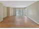 An expansive living room with tiled floors, neutral colors, and sliding doors for a light-filled space at 9481 Highland Oak Dr # 609, Tampa, FL 33647