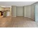 An open-concept living space boasting neutral tones and tiled floors throughout the combined living and dining area at 9481 Highland Oak Dr # 609, Tampa, FL 33647