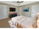 Cozy main bedroom features tile floors, ceiling fan, nice decor and neutral paint at 9481 Highland Oak Dr # 609, Tampa, FL 33647