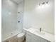 Bright bathroom with a shower, tiled walls, and a modern vanity with clean, white finishes at 15561 Aldama Cir, Port Charlotte, FL 33981