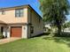 Beautiful exterior with a stone veneer and a well-manicured lawn at 659 Eunice Dr, Tarpon Springs, FL 34689